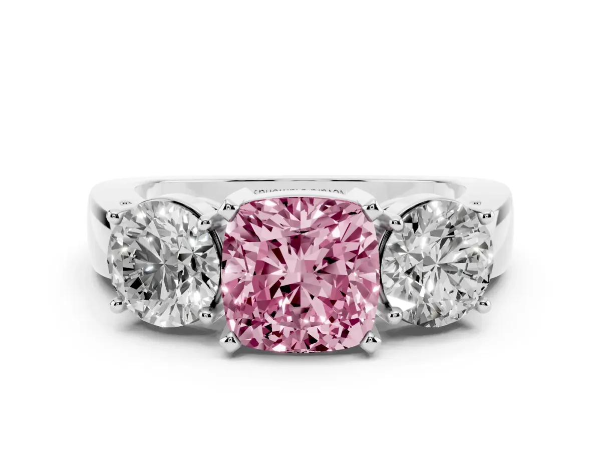 Fancy Pink Cushion Cut Diamond Three-Stone Ring Set in White gold with Round Side Stones and Classic Band