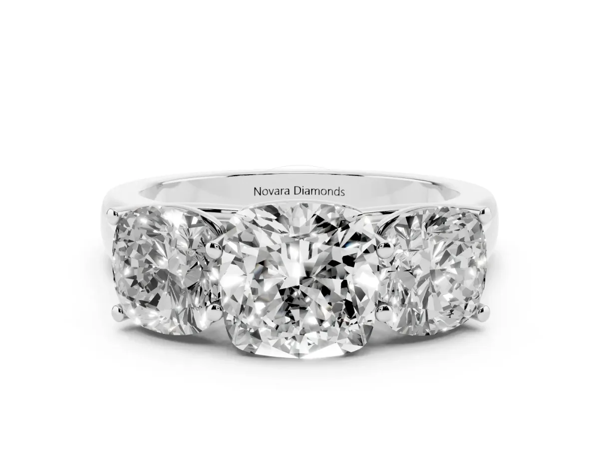 Cushion Cut Diamond Three-Stone Ring Set in Platinum with Plain Polished Band