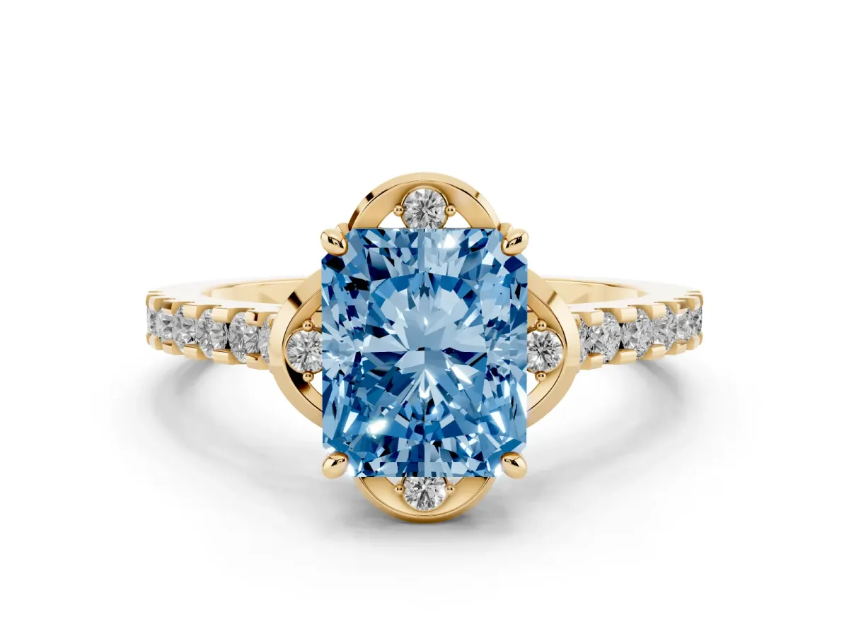 Fancy Blue Radiant Cut Diamond Solitaire Ring Set in Yellow gold with Pavé Band and Floral Prong Setting
