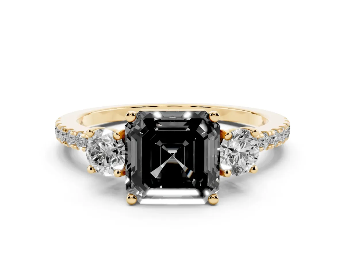 Fancy Black Asscher Cut Diamond Three-Stone Ring Set in Yellow gold with Pavé Band and Graduated Sides