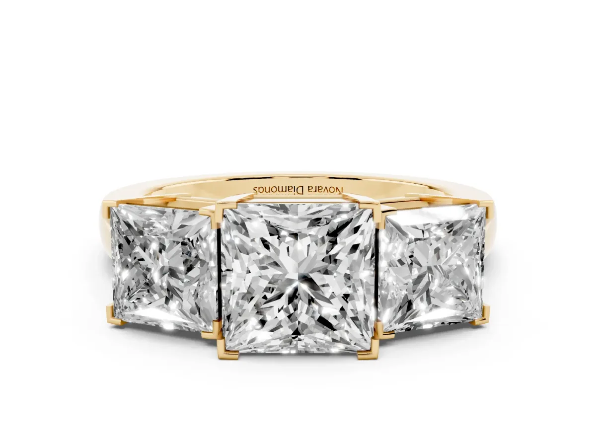 Princess Cut Diamond Three-Stone Ring Set in Yellow gold with Channel-Set Band and Prong Settings