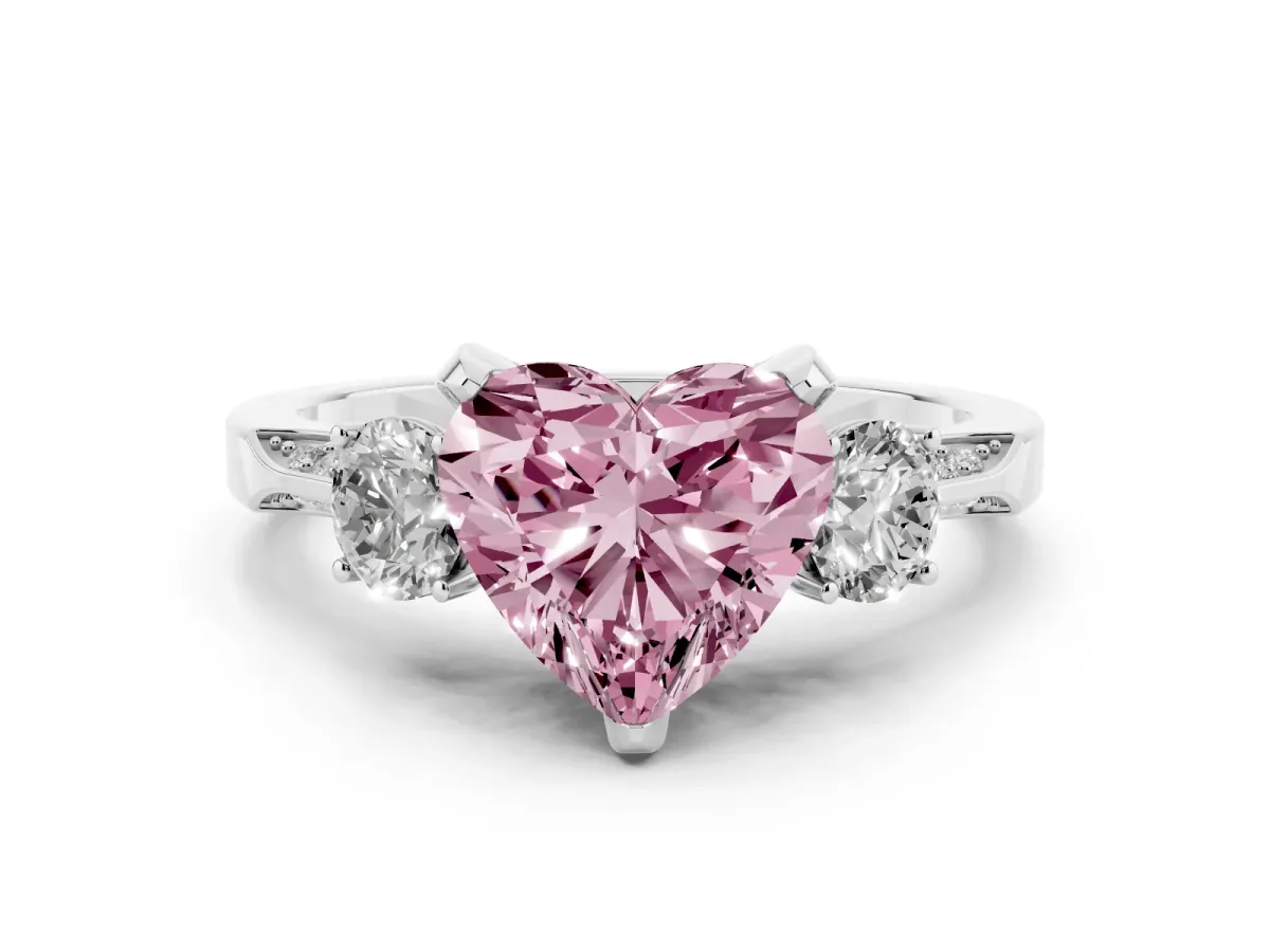 Fancy Pink Heart Cut Diamond Three-Stone Ring Set in Silver with Pavé Band and Smaller Side Stones