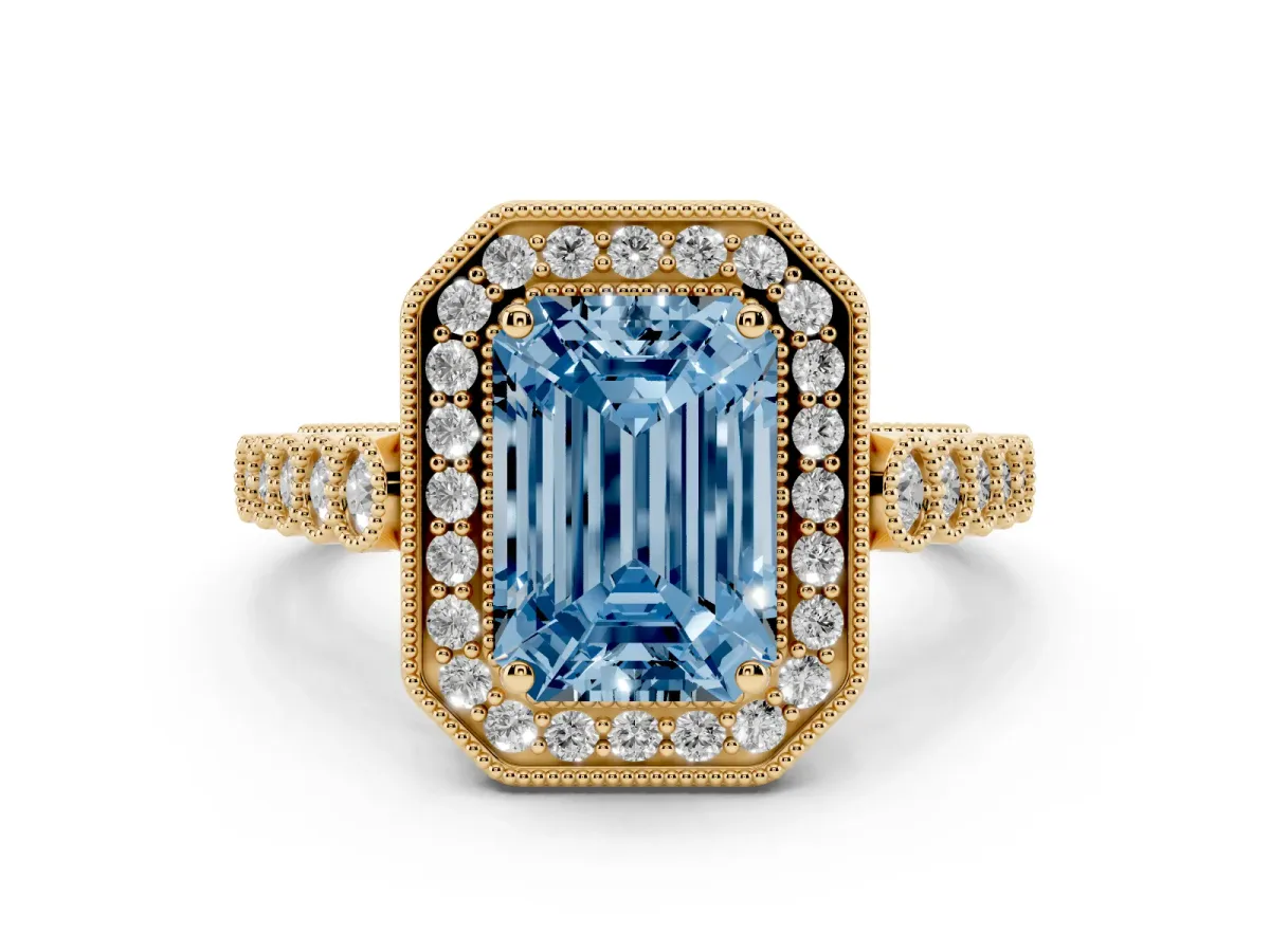 Fancy Blue Emerald Cut Diamond Milgrain Halo Solitaire Ring Set in Yellow gold with Bezel Set Side Stones and Pavé Band