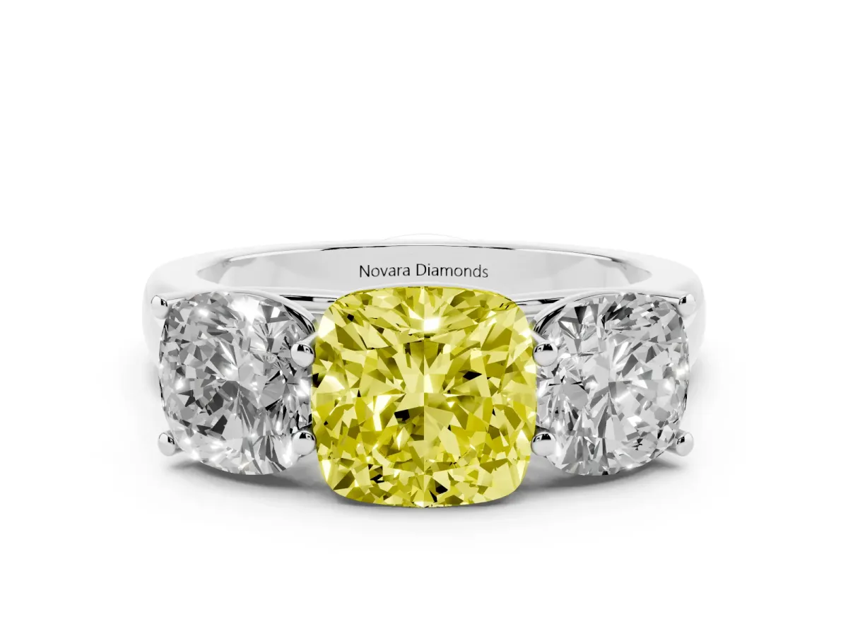 Fancy Yellow Cushion Cut Diamond Three-Stone Ring Set in Platinum with Plain Polished Band