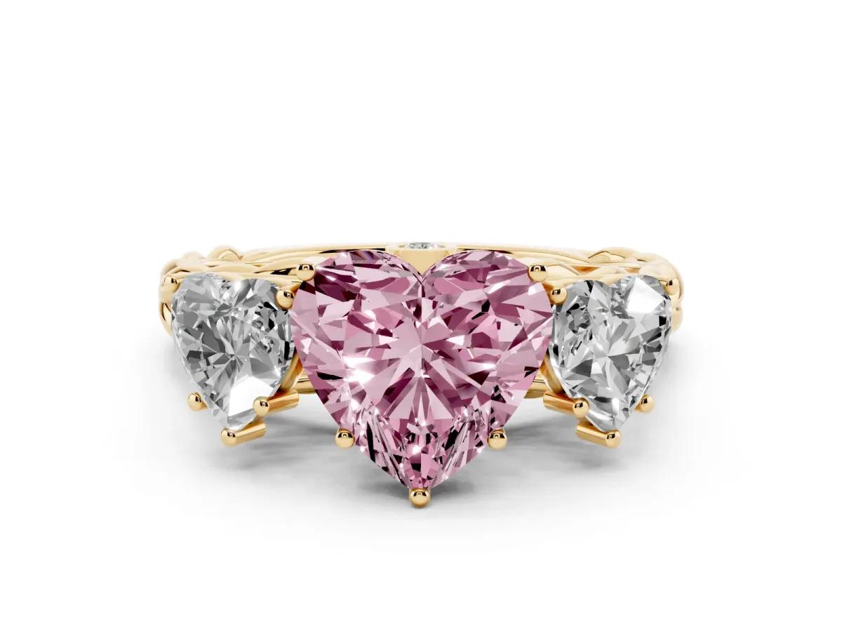 Fancy Pink Heart Cut Diamond Three-Stone Ring Set in Yellow gold with Braided Band