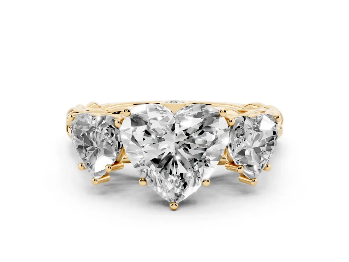 Heart Cut Diamond Three-Stone Ring Set in Yellow gold with Braided Band
