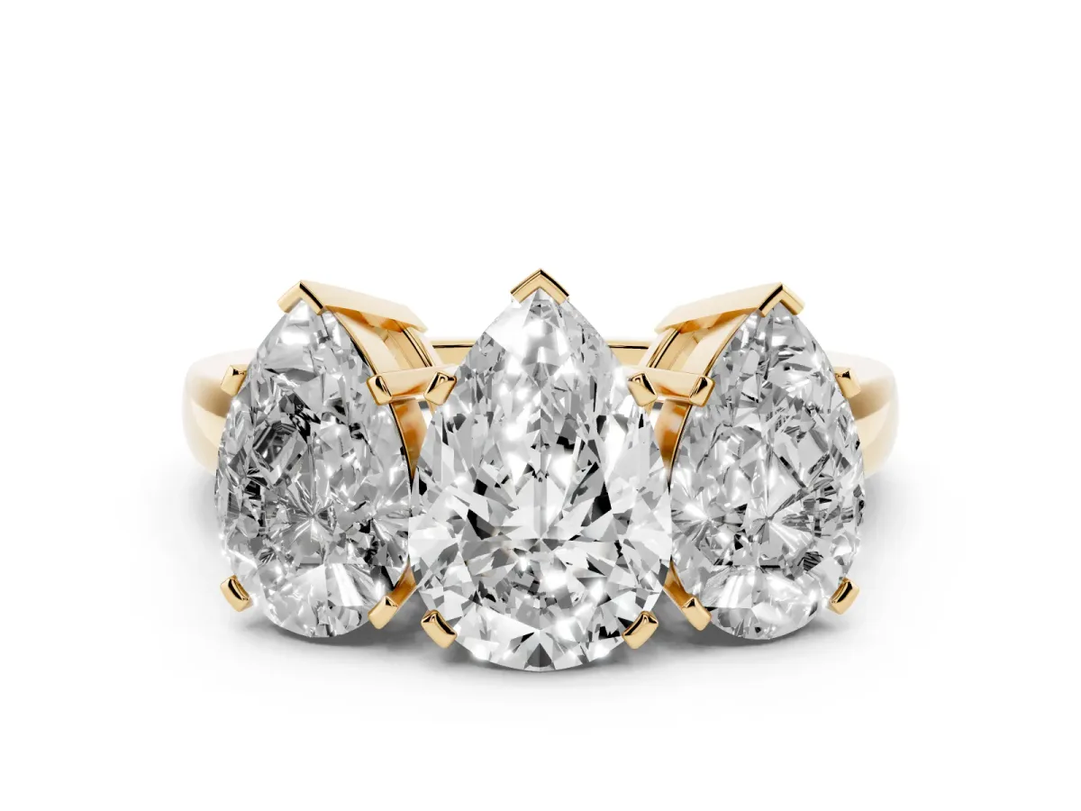 Pear Cut Diamond Three-Stone Ring Set in Yellow gold with Channel-Set Band and Prong Settings