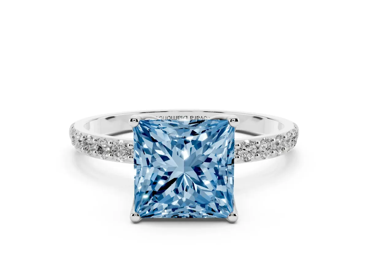 Fancy Blue Princess Cut Diamond Solitaire Engagement Ring Set in White gold with Round Pavé Band and Prong Setting