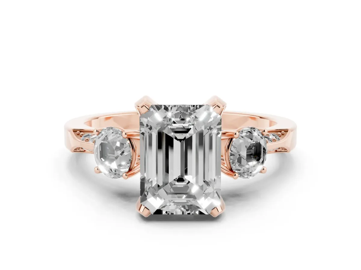 Fancy Pink Emerald Cut Diamond Three-Stone Ring Set in Rose gold with Pavé Band and Smaller Side Stones