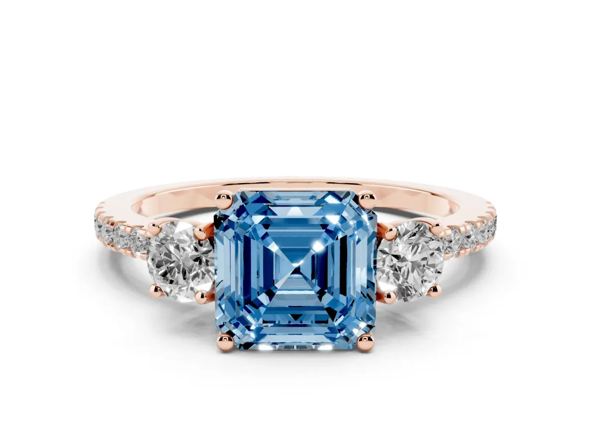 Fancy Blue Asscher Cut Diamond Three-Stone Ring Set in Rose gold with Pavé Band and Graduated Sides
