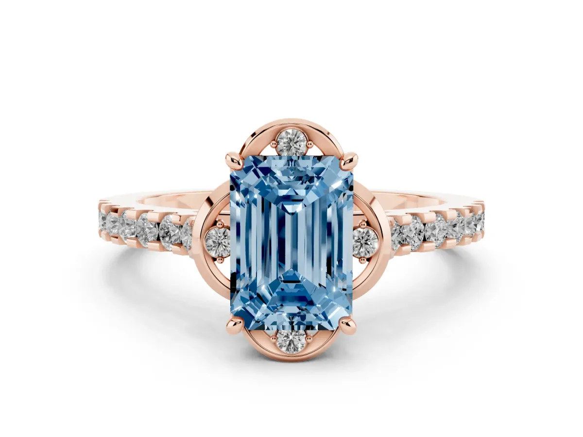 Fancy Blue Emerald Cut Diamond Solitaire Ring Set in Rose gold with Pavé Band and Floral Prong Setting