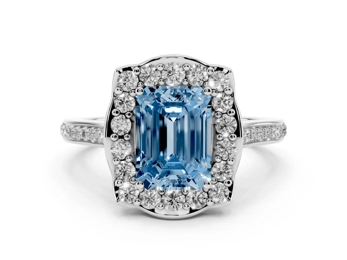 Fancy Blue Emerald Cut Diamond Halo Ring Set in Platinum with Pavé-Lined Shoulders and Prong Setting