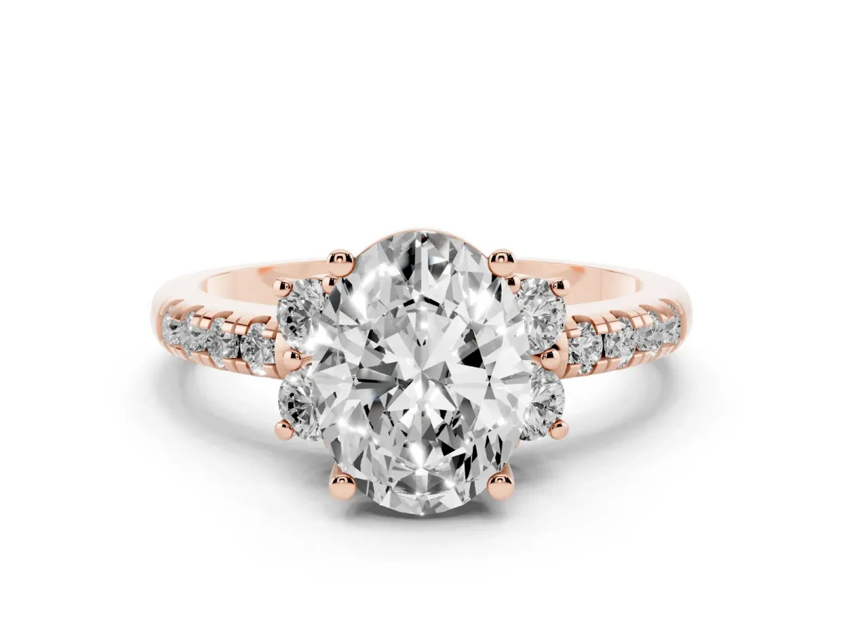 Oval Cut Diamond Three-Stone Pavé Ring Set in Rose gold with Prong Setting