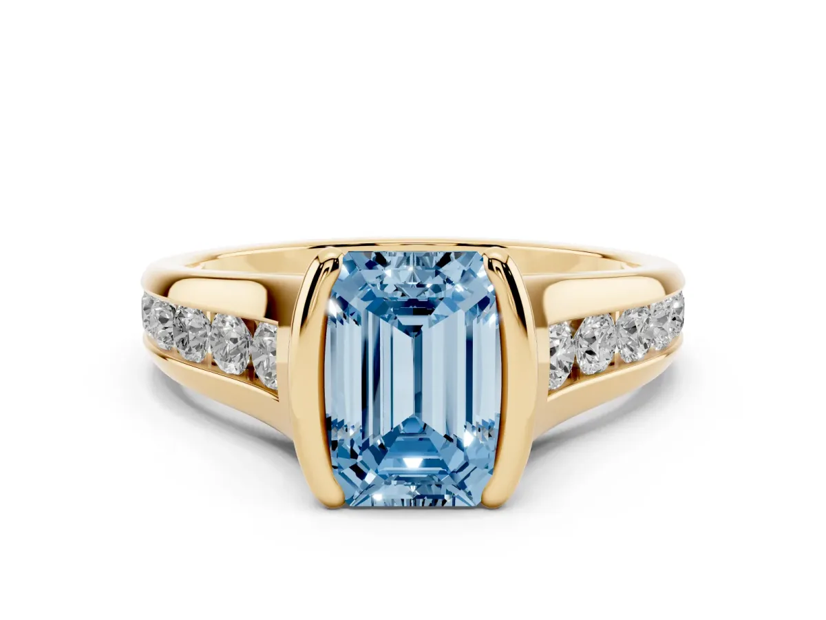 Fancy Blue Emerald Cut Diamond Bezel-Set Solitaire Ring Set in Yellow gold with Channel-Set Band