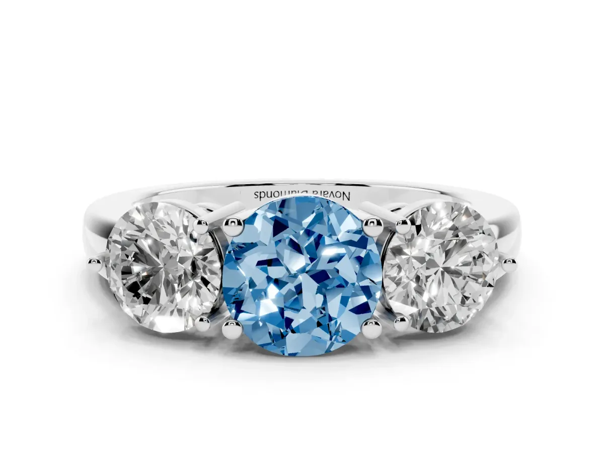 Fancy Blue Round Cut Diamond Three-Stone Ring Set in Platinum with Prong Setting and Plain Band