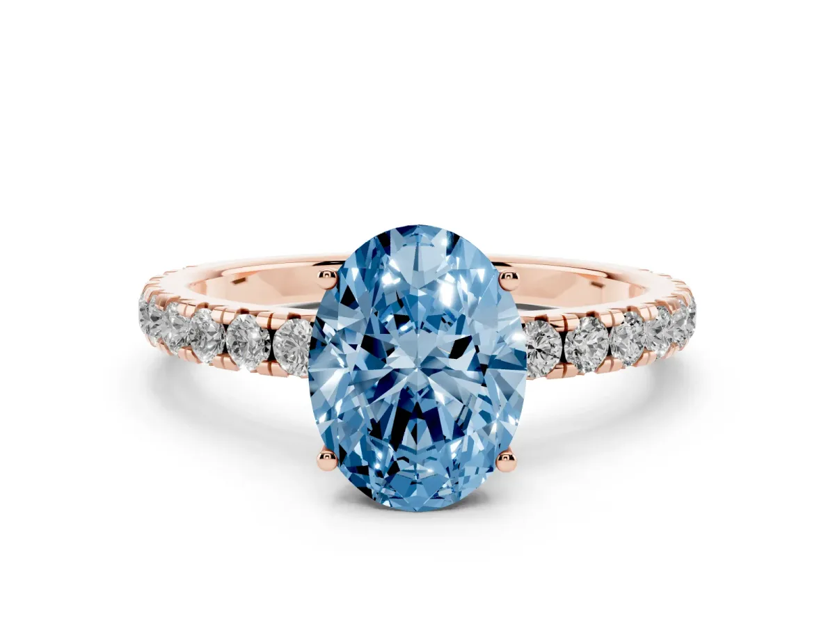 Fancy Blue Oval Cut Diamond Pavé Solitaire Engagement Ring Set in Rose gold with Prong Setting