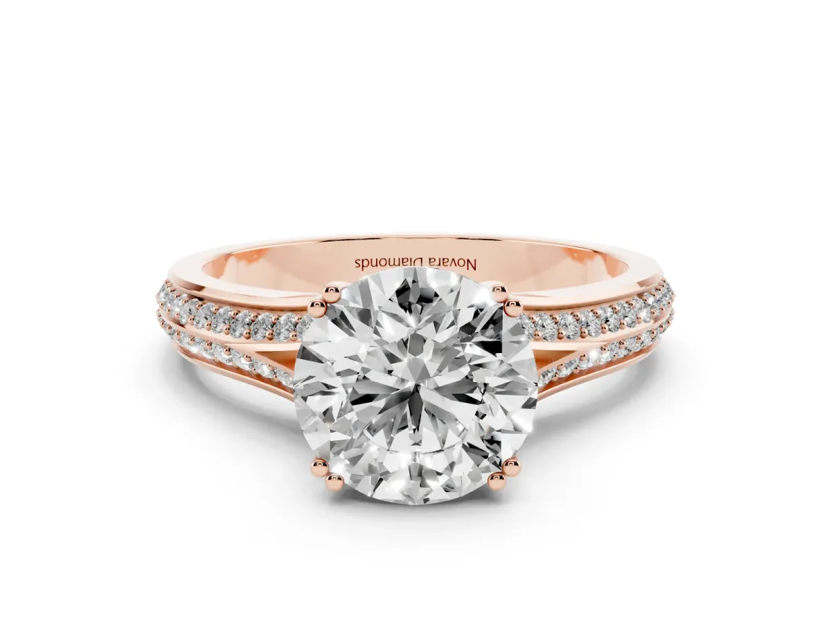 Round Cut Diamond Split Shank Pavé Engagement Ring Set in Rose gold with Prong-Set Center Stone