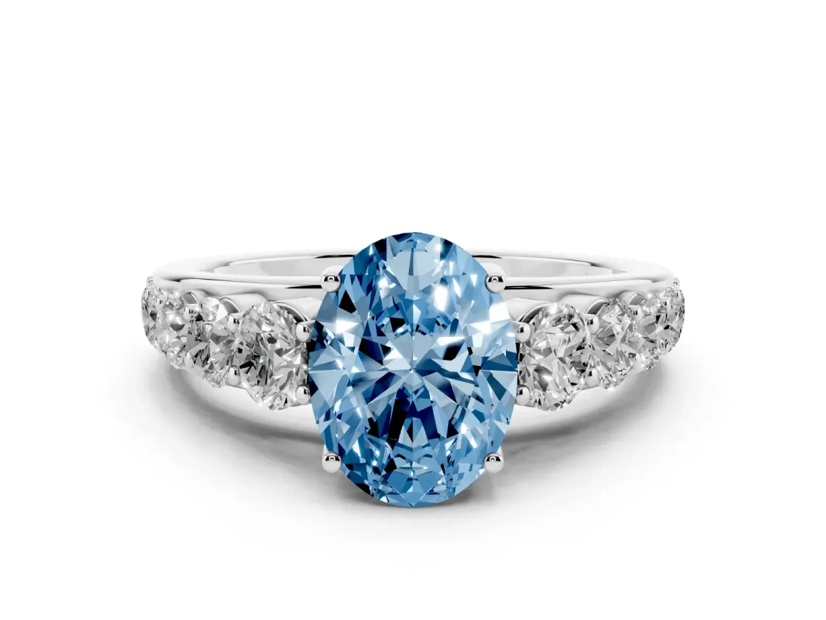 Fancy Blue Oval Cut Diamond Solitaire Ring Set in White gold with Pavé-Set Band and Prong Setting