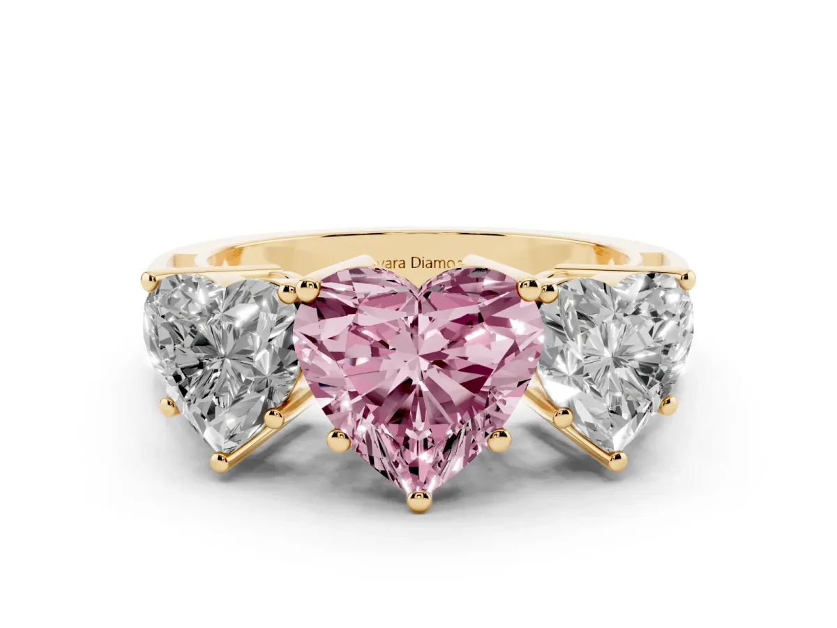 Fancy Pink Heart Cut Diamond Three-Stone Ring Set in Yellow gold with Textured Band