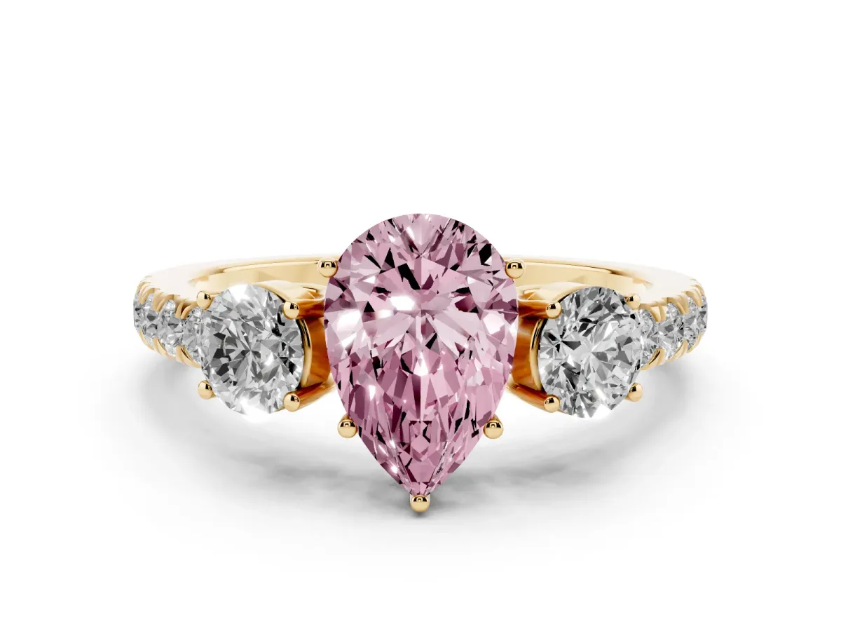 Fancy Pink Pear Cut Diamond Three-Stone Ring Set in Yellow gold with Round Side Stones and Delicate Pavé Band