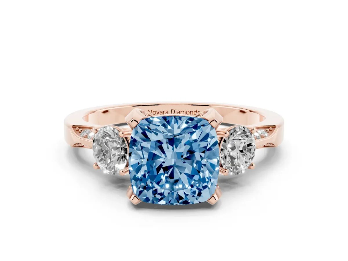 Fancy Blue Cushion Cut Diamond Three-Stone Ring Set in Rose gold with Pavé Band and Smaller Side Stones