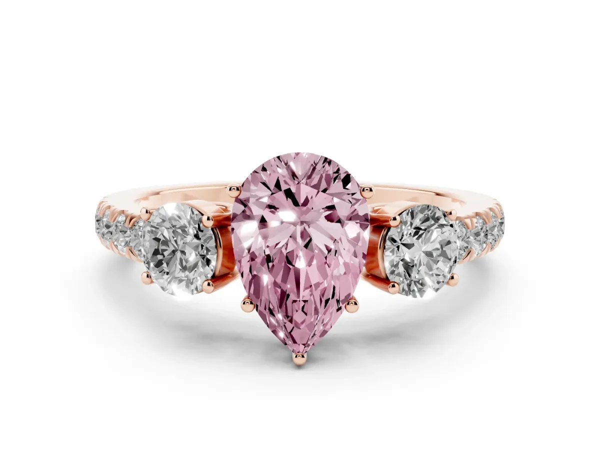 Fancy Pink Pear Cut Diamond Three-Stone Ring Set in Rose gold with Round Side Stones and Delicate Pavé Band