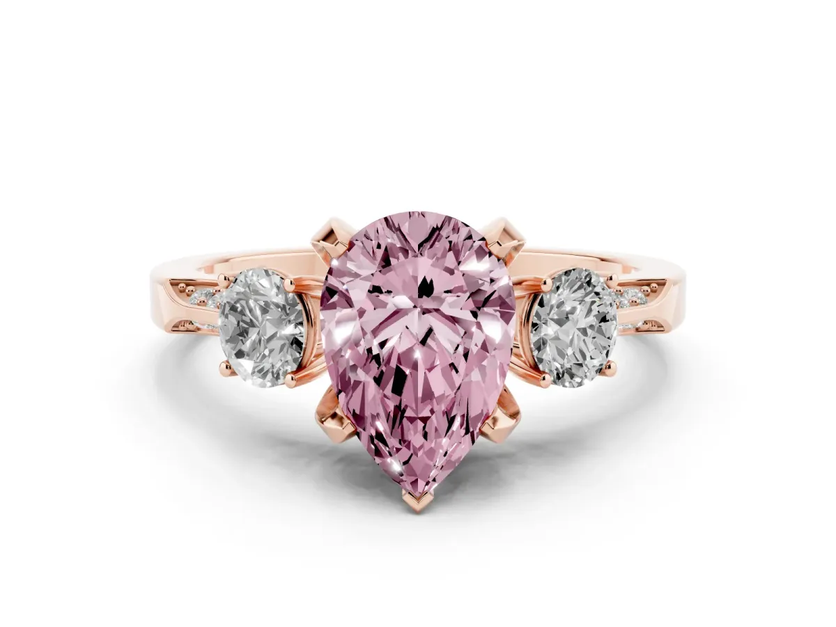 Fancy Pink Pear Cut Diamond Three-Stone Ring Set in Rose gold with Pavé Band and Smaller Side Stones