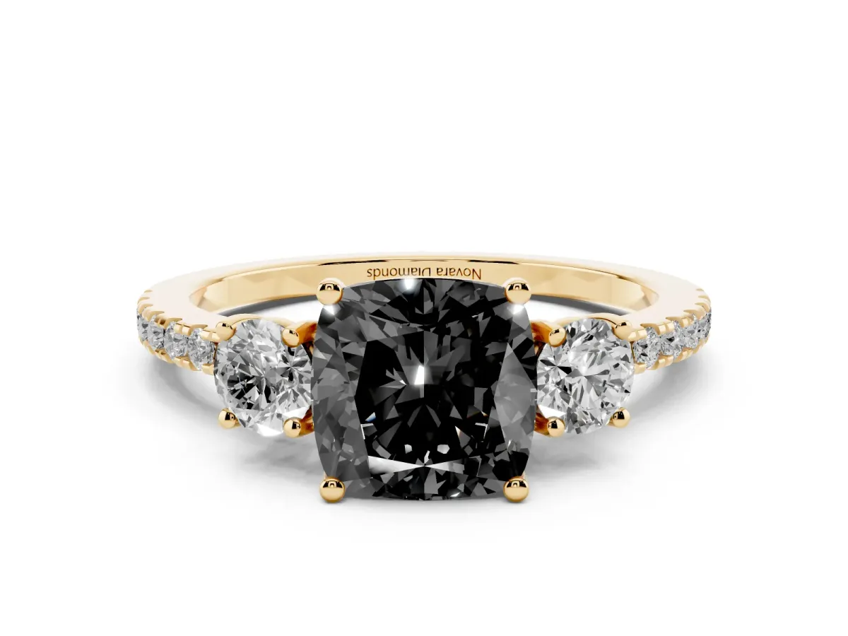 Fancy Black Cushion Cut Diamond Three-Stone Ring Set in Yellow gold with Pavé Band and Graduated Sides