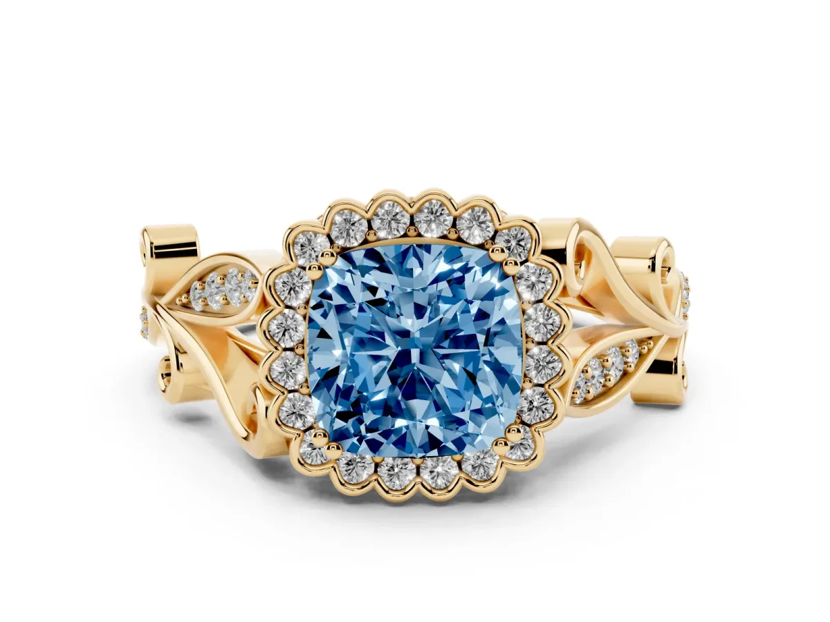 Fancy Blue Cushion Cut Diamond Halo Ring Set in Yellow gold with Leaf Motif Split Shank and Prong Setting