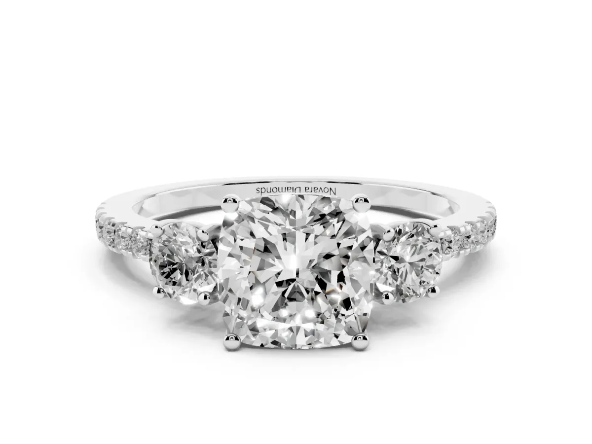 Cushion Cut Diamond Three-Stone Ring Set in White gold with Pavé Band and Graduated Sides
