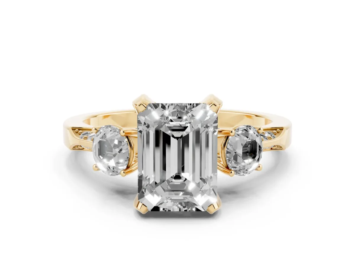 Fancy Pink Emerald Cut Diamond Three-Stone Ring Set in Yellow gold with Pavé Band and Smaller Side Stones