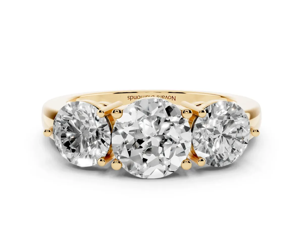 Round Cut Diamond Three-Stone Ring Set in Yellow gold with Prong Setting and Plain Band