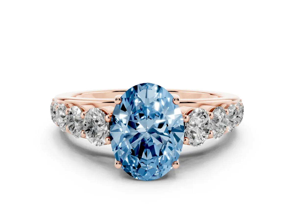 Fancy Blue Oval Cut Diamond Solitaire Ring Set in Rose gold with Pavé-Set Band and Prong Setting