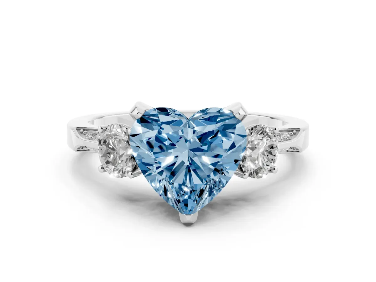 Fancy Blue Heart Cut Diamond Three-Stone Ring Set in Platinum with Pavé Band and Smaller Side Stones