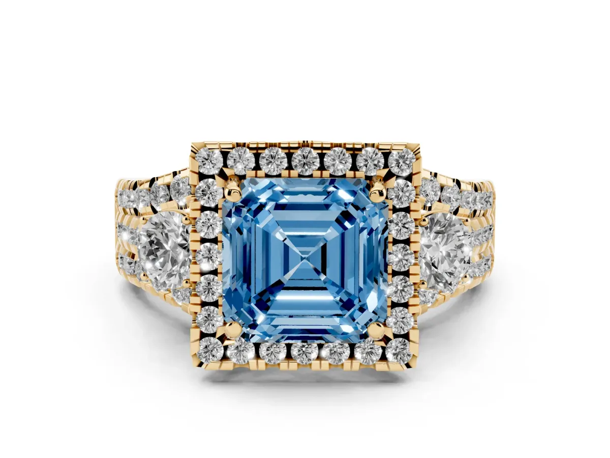 Fancy Blue Asscher Cut Diamond Halo Split Shank Ring Set in Yellow gold with Round Accent Stones and Prong Setting