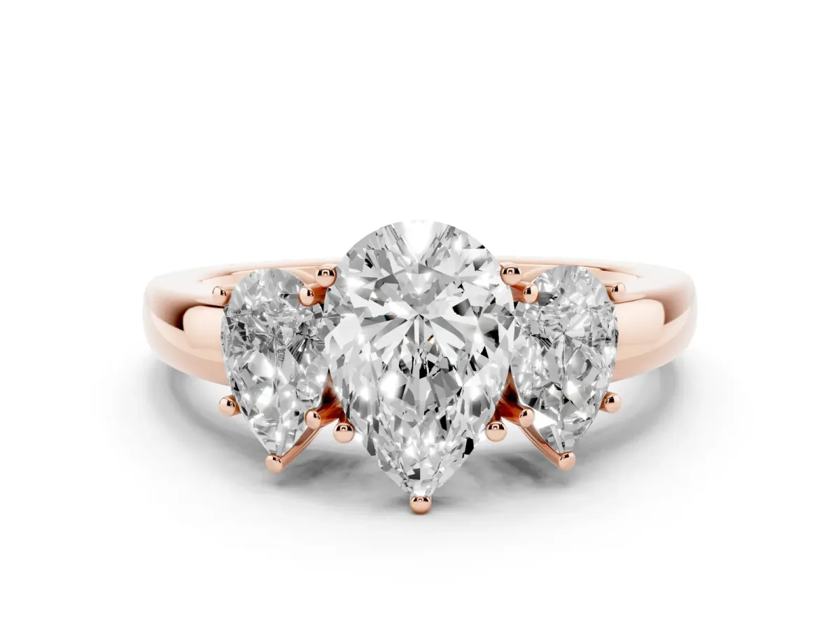 Pear Cut Diamond Three-Stone Ring Set in Rose gold with Bold Center and Classic Band