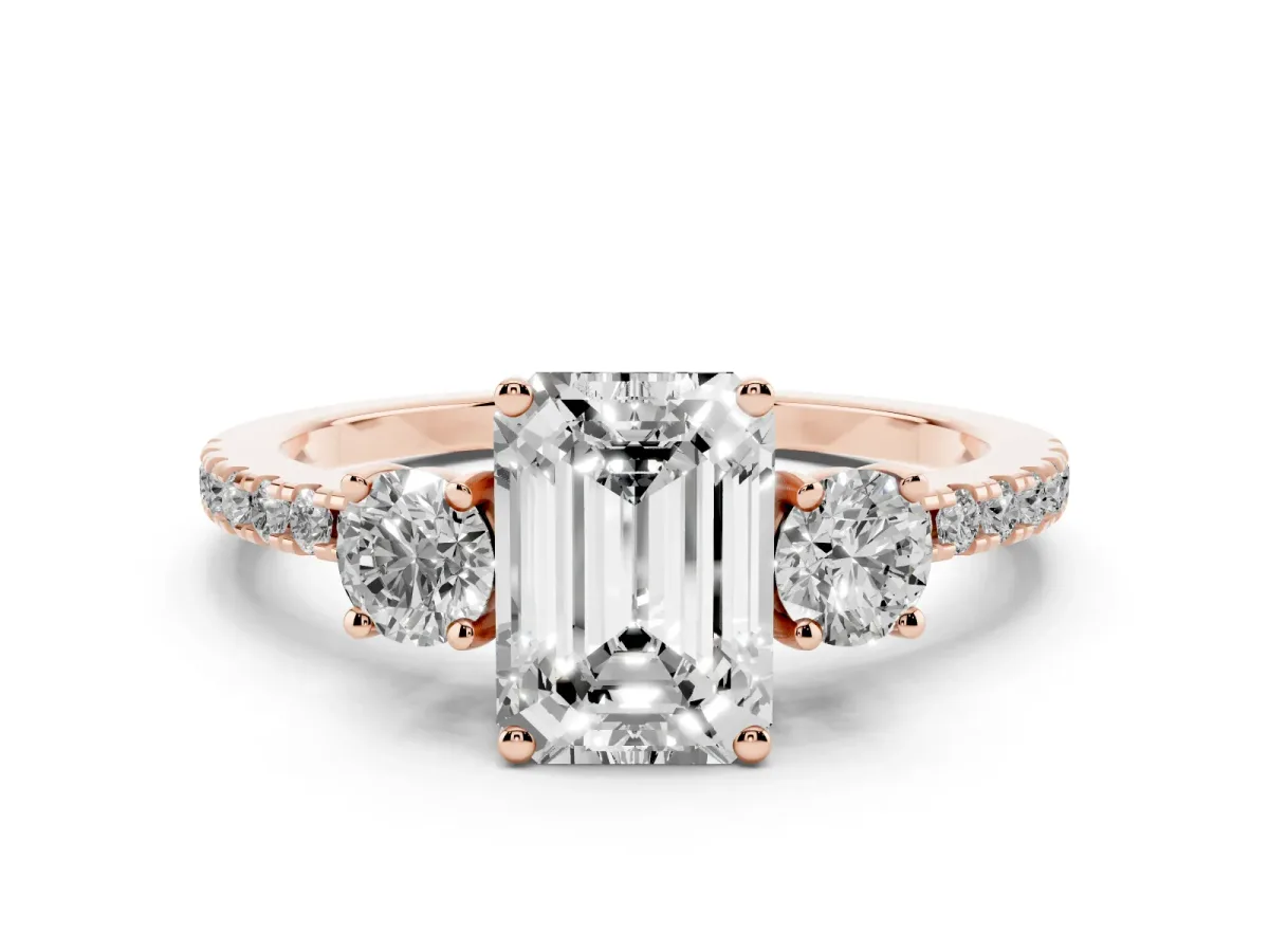 Emerald Cut Diamond Three-Stone Ring Set in Rose gold with Pavé Band and Graduated Sides