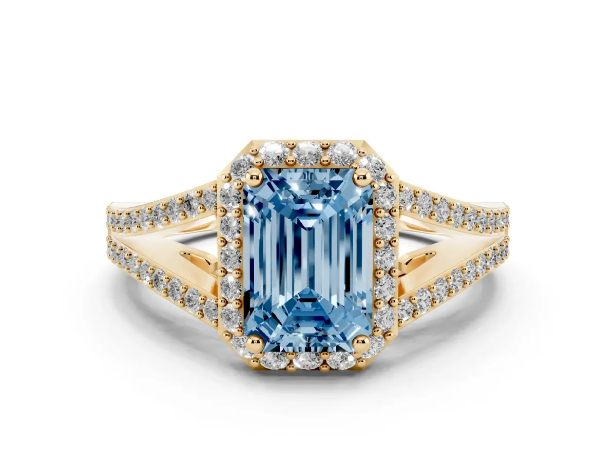 Fancy Blue Emerald Cut Diamond Halo Split Shank Pavé Ring Set in Yellow gold with Prong Setting