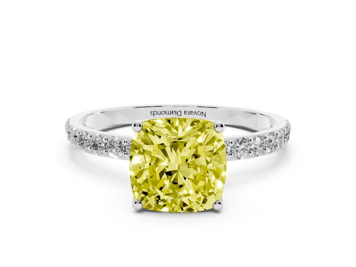 Fancy Yellow Cushion Cut Diamond Solitaire Engagement Ring Set in White gold with Round Pavé Band and Prong Setting