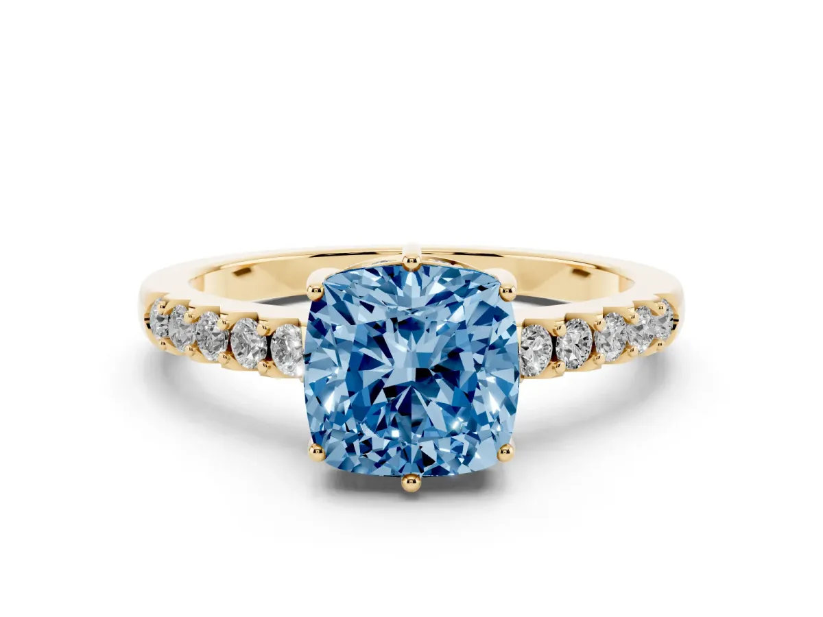 Fancy Blue Cushion Cut Diamond Solitaire Engagement Ring Set in Yellow gold with Pavé Band and Prong Setting