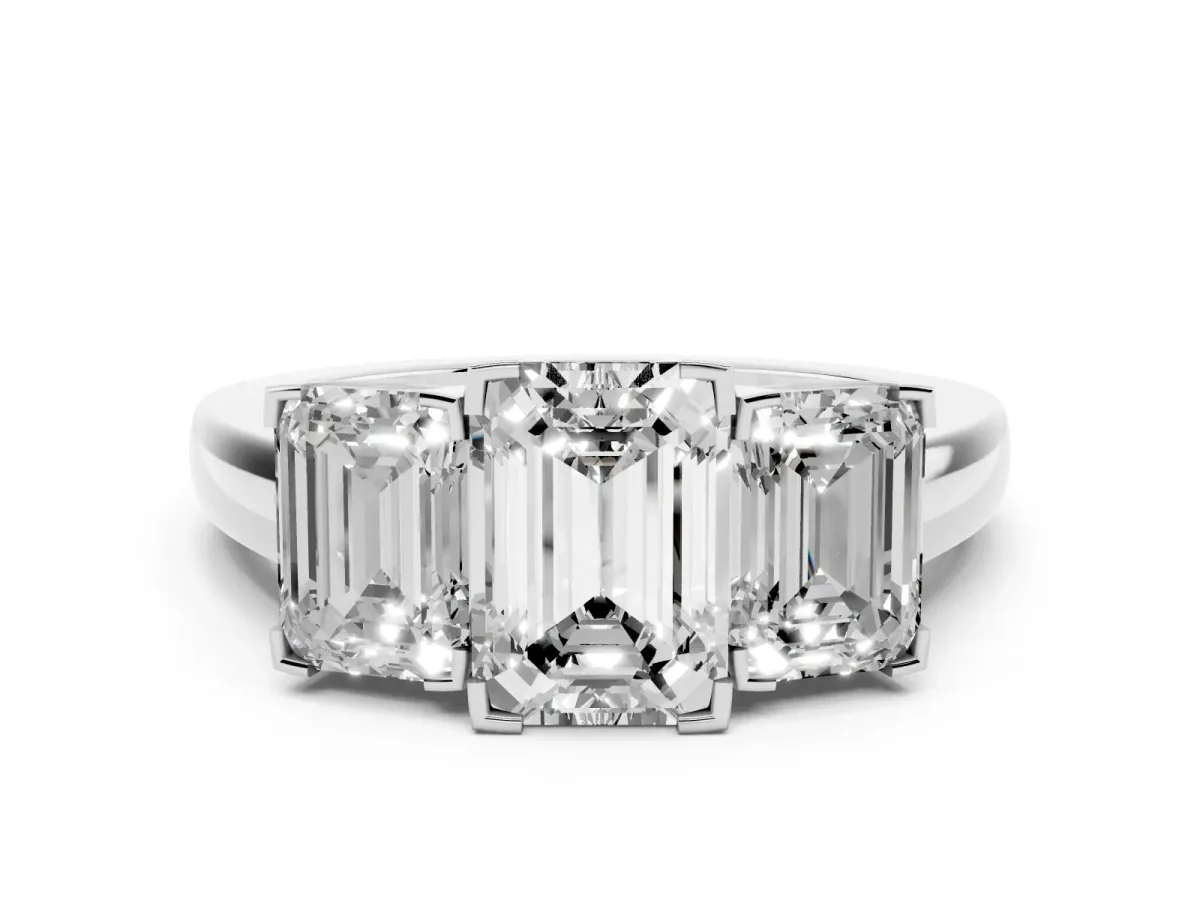 Emerald Cut Diamond Three-Stone Ring Set in Silver with Channel-Set Band and Prong Settings