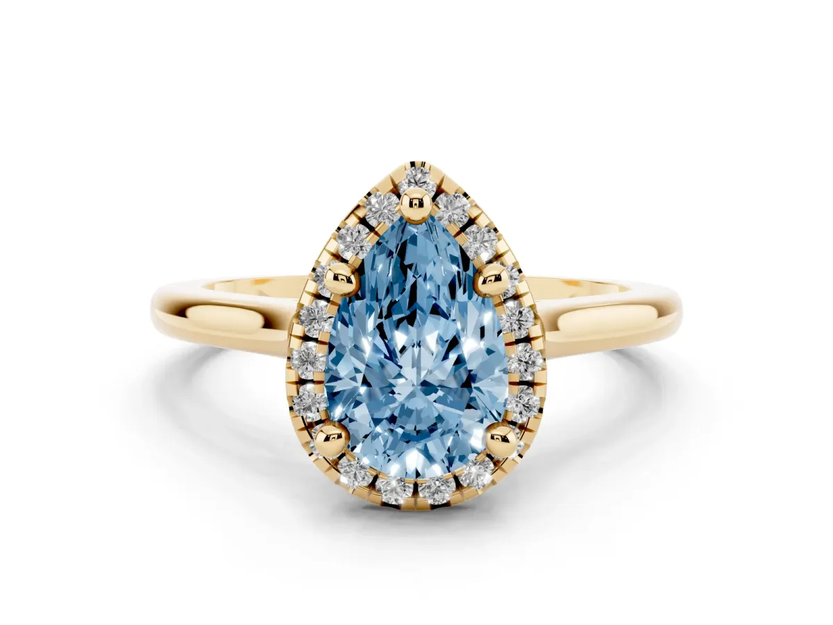 Fancy Blue Pear Cut Diamond Halo Engagement Ring Set in Yellow gold with Pavé Band and Rising Shoulders