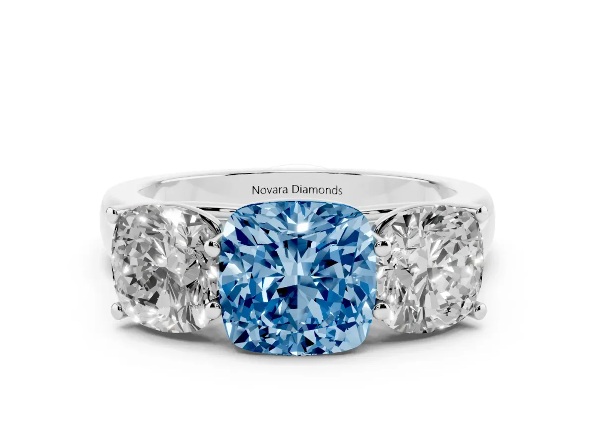 Fancy Blue Cushion Cut Diamond Three-Stone Ring Set in White gold with Plain Polished Band