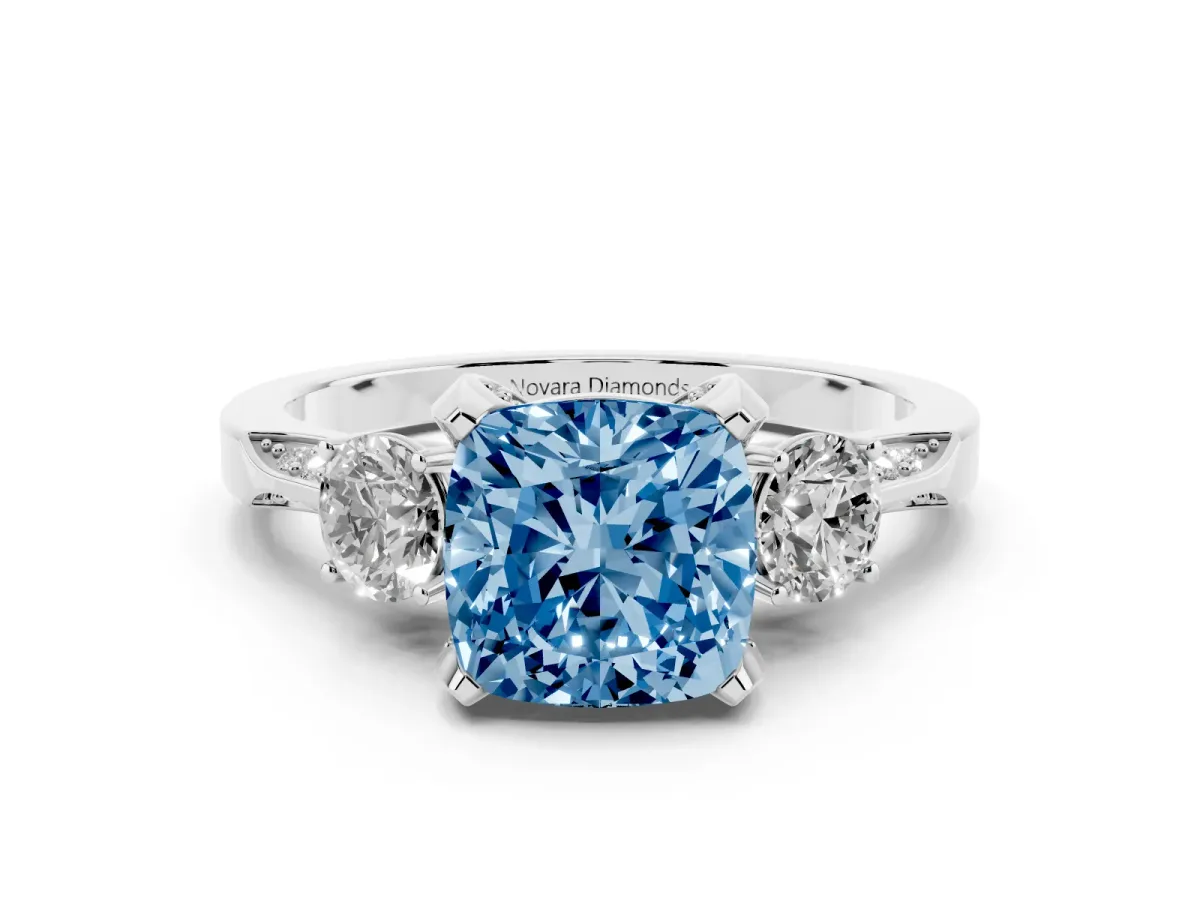 Fancy Blue Cushion Cut Diamond Three-Stone Ring Set in White gold with Pavé Band and Smaller Side Stones