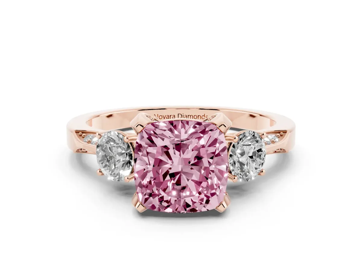 Fancy Pink Cushion Cut Diamond Three-Stone Ring Set in Rose gold with Pavé Band and Smaller Side Stones