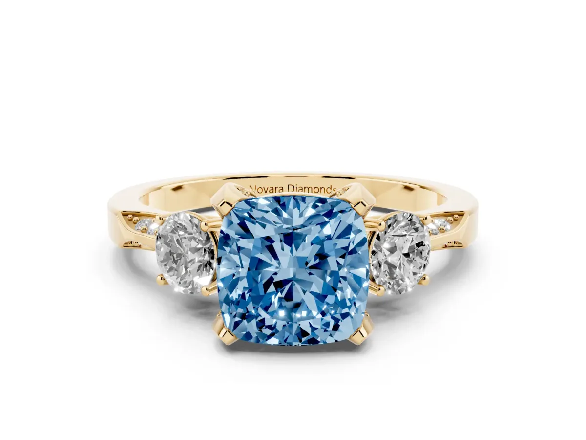 Fancy Blue Cushion Cut Diamond Three-Stone Ring Set in Yellow gold with Pavé Band and Smaller Side Stones