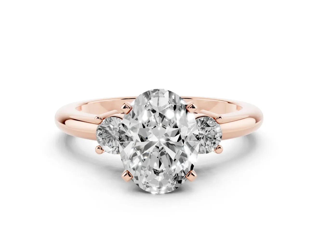 Three-Stone Oval Cut Diamond Ring Set in Rose gold with Prong Setting and Plain Band