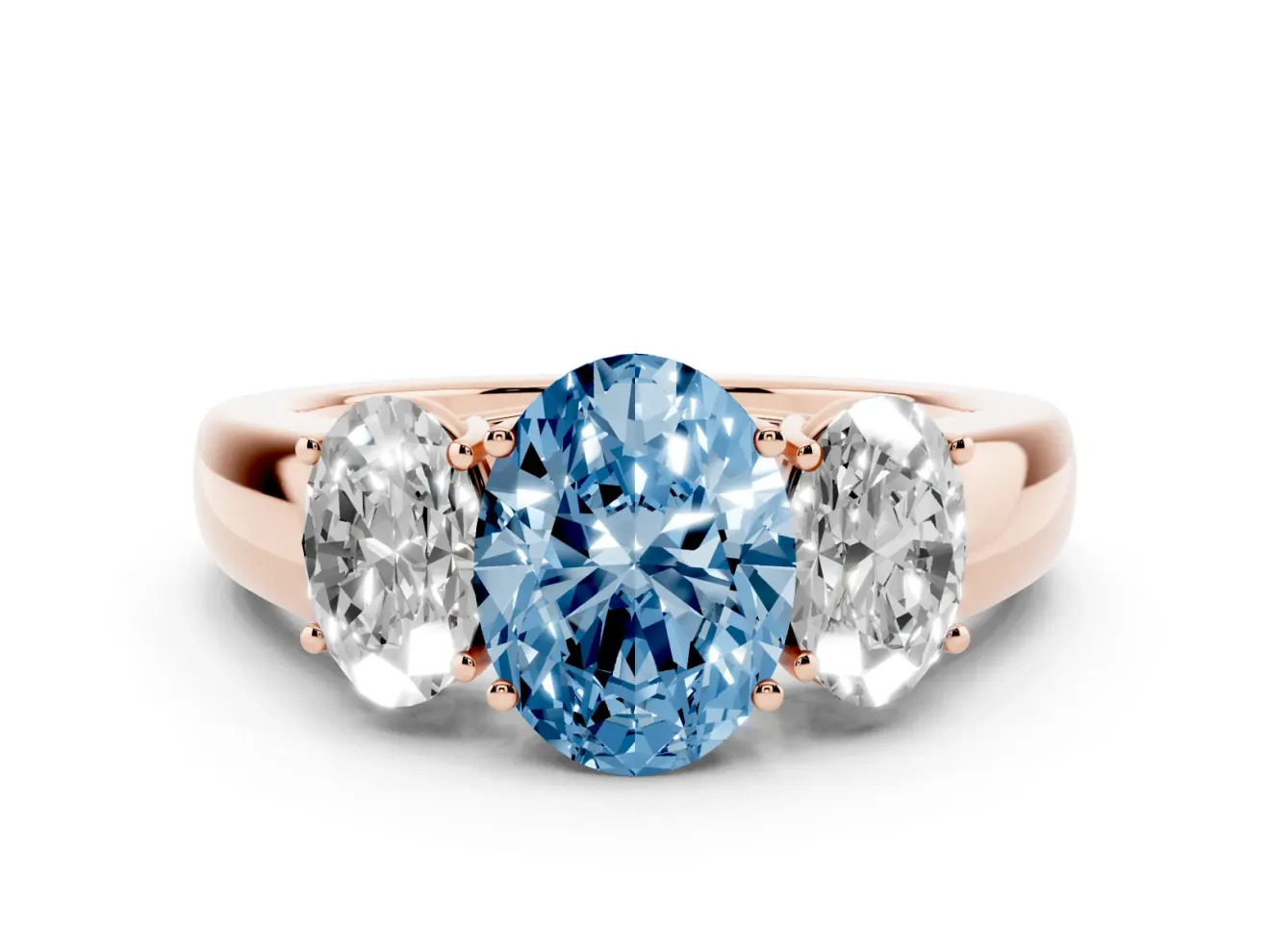 Fancy Blue Three-Stone Oval Cut Diamond Ring Set in Rose gold with Matching Prong Settings and Plain Band
