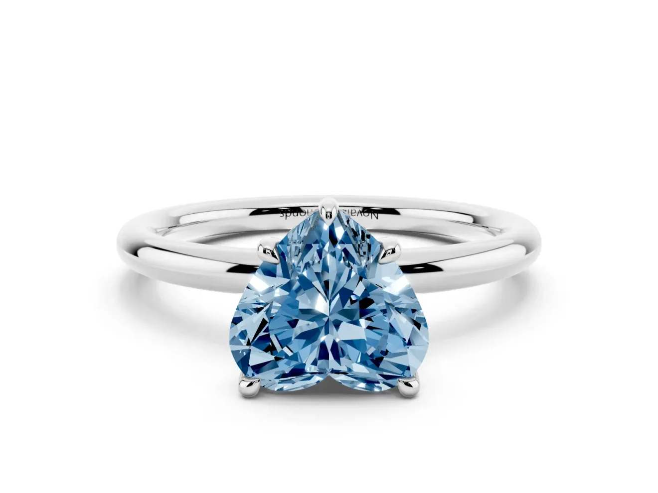 Fancy Blue Heart Cut Diamond Solitaire Ring Set in Platinum with Thin Band and Prong Setting