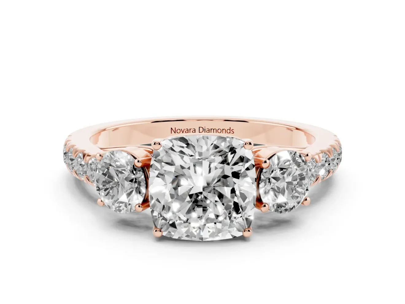Cushion Cut Diamond Three-Stone Ring Set in Rose gold with Round Side Stones and Delicate Pavé Band